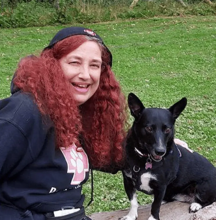Photo of Paws2Rescue team member Linda with a dog